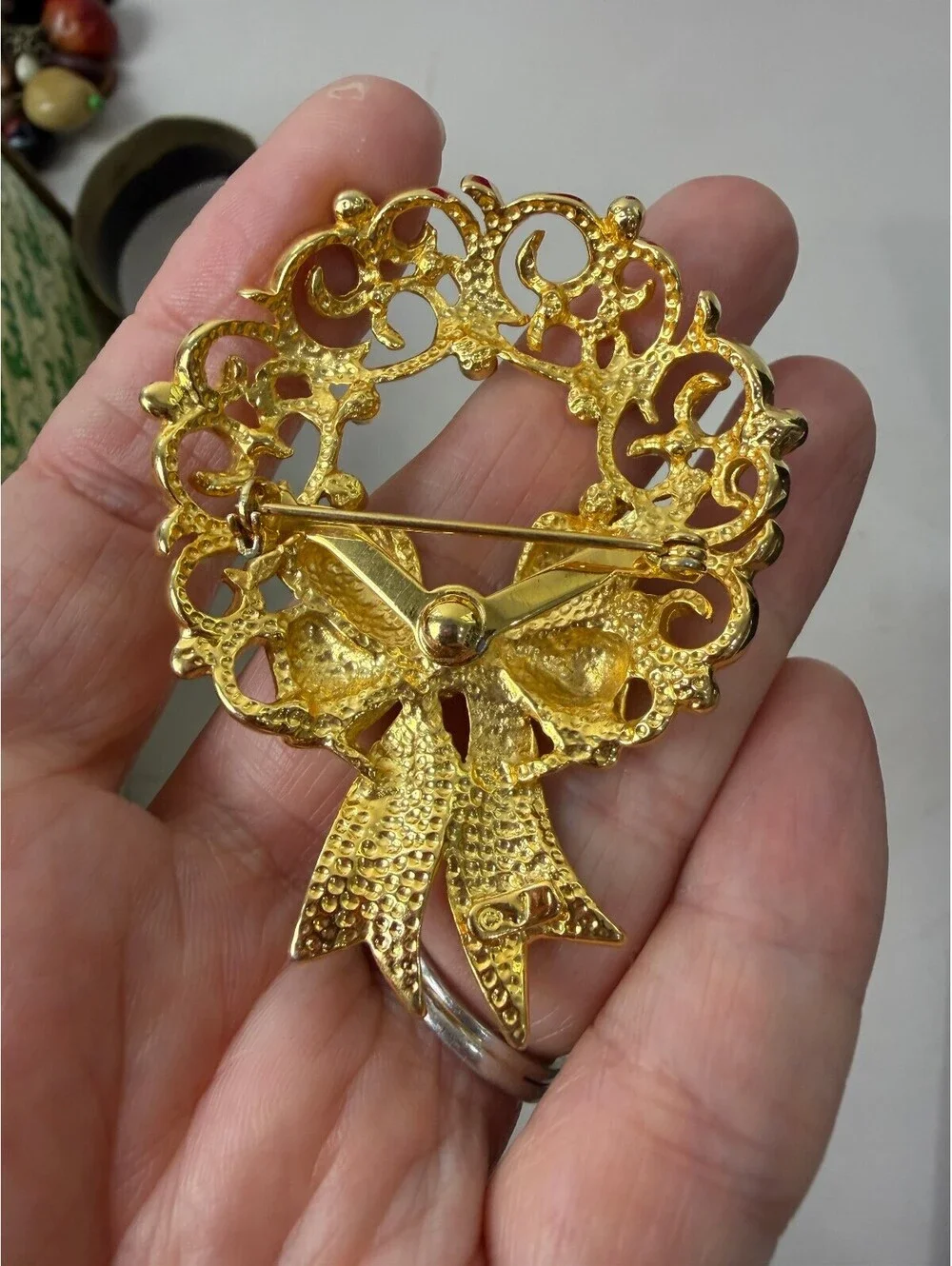 Vintage JJ Gold Tone Wreath Brooch with Bow and Rhinestones